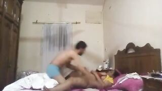 الراجل والشرموطه عالسرير مغطين نص جسمهم وهو فوق منها بيبوس في شفايفهعا وبرقبتها وهي ماسكه ز سكس مصري وبره بتلعب فيه علشان يوقف يحمبط وينيكها